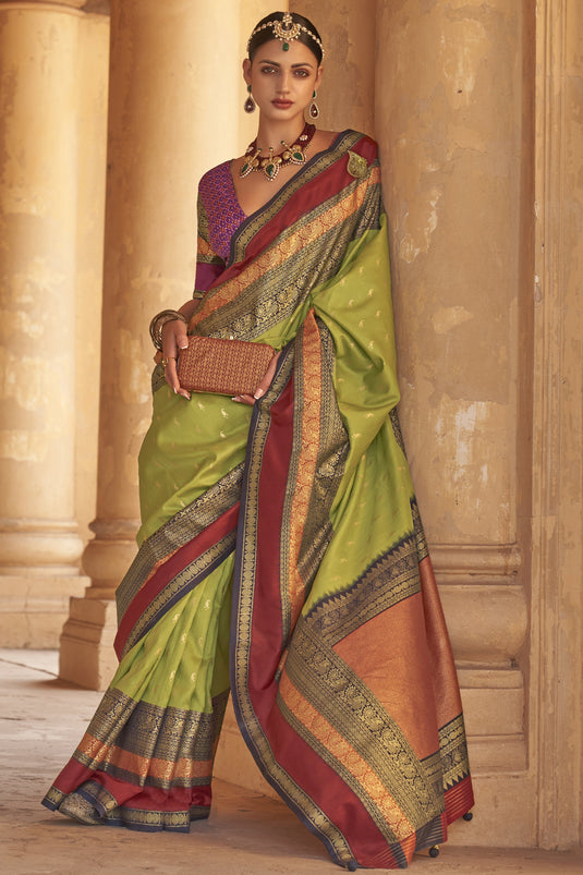 Green Color Kanjivaram Silk Fabric Fancy Weaving Print Sangeet Wear Saree With Patola Design Blouse