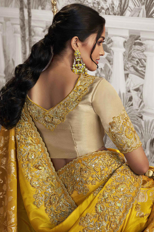 Appealing Heavy Embroidery Work Fancy Fabric Yellow Color Saree With Party Look Blouse