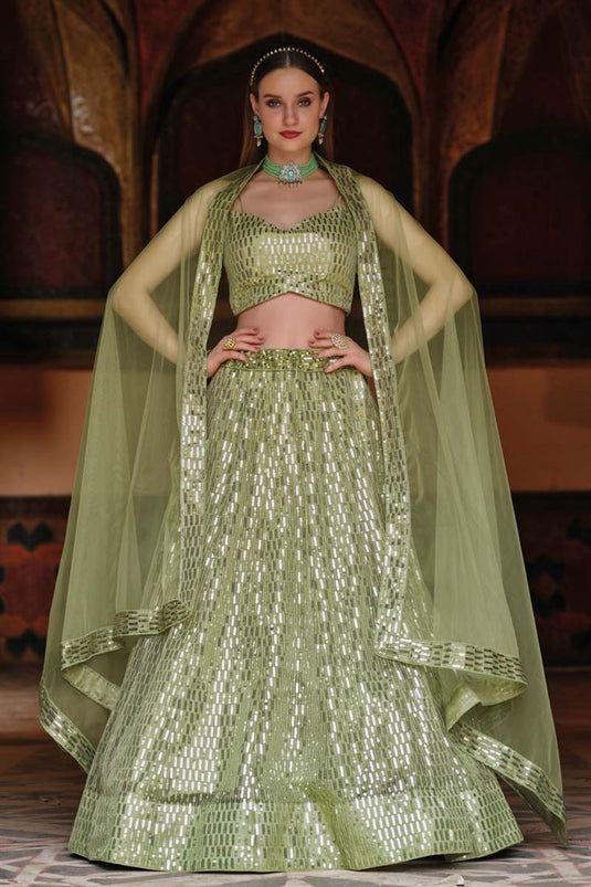 Sangeet Wear Net Fabric Khaki Color Sequins Work Extravagant Lehenga