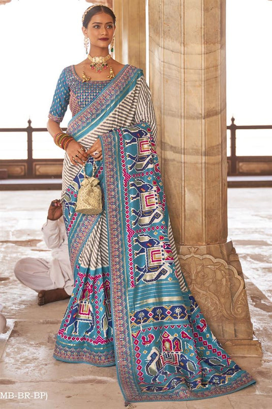 Patola Silk Fabric Function Wear Printed Luxurious Saree With Semi Stitched Blouse In Cyan Color