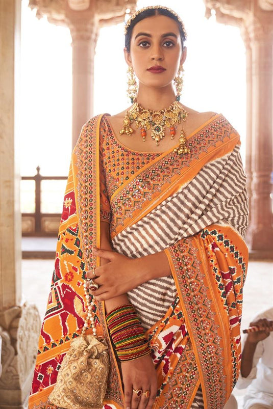 Patola Silk Fabric Printed Function Wear Vivacious Saree With Semi Stitched Blouse In Musatrd Color