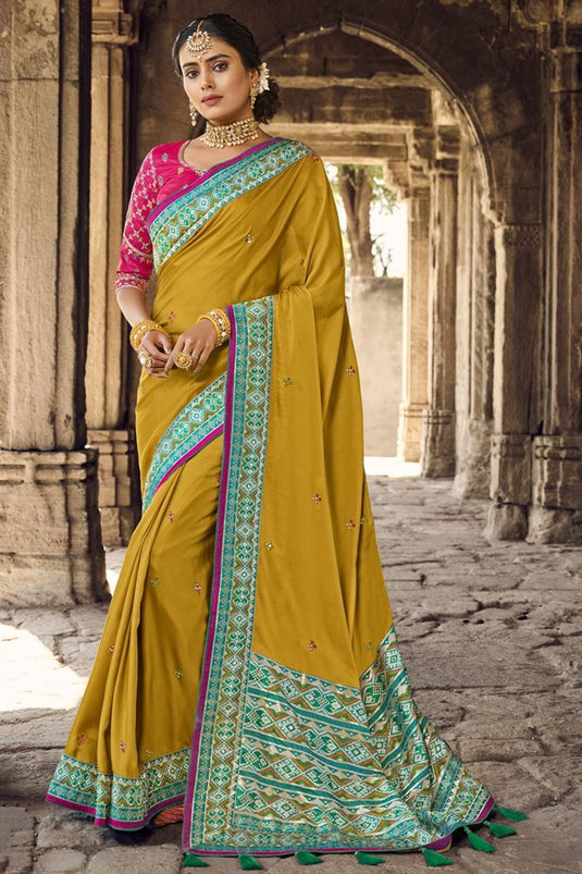 Weaving Work On Attractive Banarsi Style Silk Saree In Mustard Color