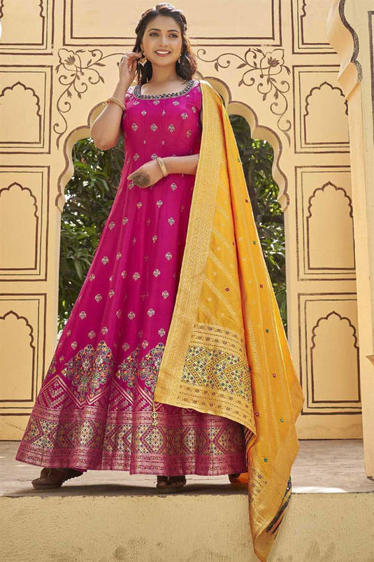 Art Silk Fabric Festival Wear Mesmeric Gown With Dupatta In Rani Color