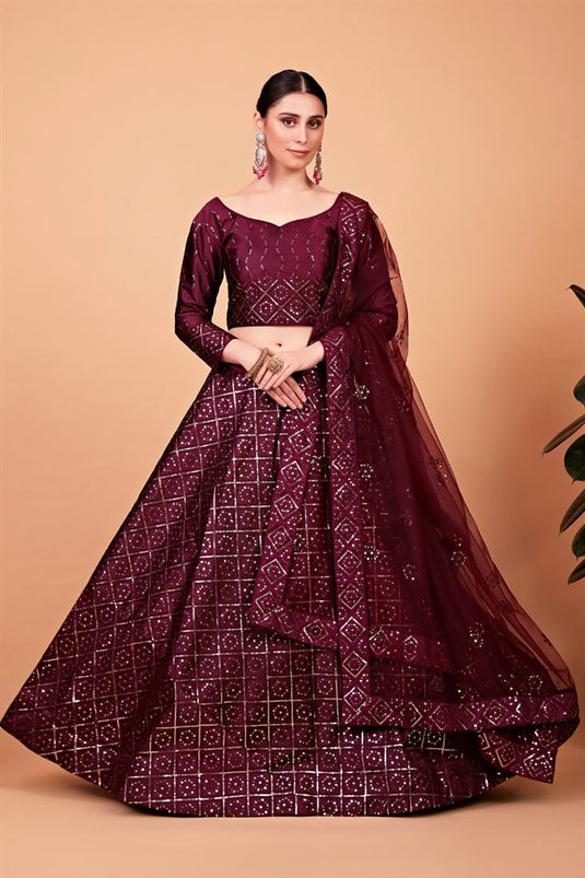 Sangeet Wear Elegant Net Fabric Lehenga In Wine Color