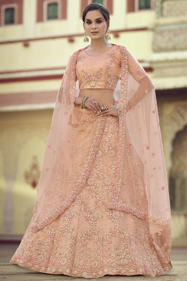 Exclusive Wedding Wear Net Fabric Sequins Work Lehenga Choli In Peach