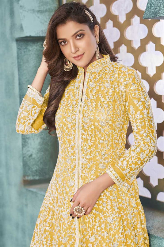Function Wear Net Fabric Ingenious Embroidered Work Anarkali Suit In Yellow Color