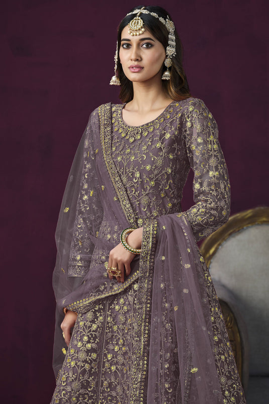 Attractive Embroidered Lavender Color Anarkali Salwar Kameez In Net Fabric