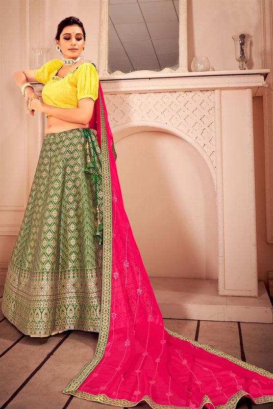 Sangeet Wear Weaving Work Art Silk Lehenga With Contrast Dupatta In Dazzling Green Color