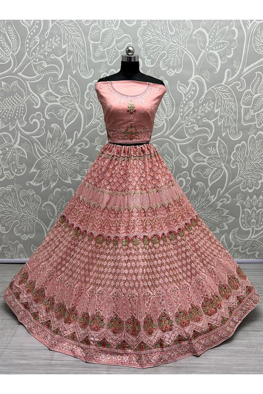 Net Fabric Brilliant Sequins Work Bridal Look Lehenga In Peach Color
