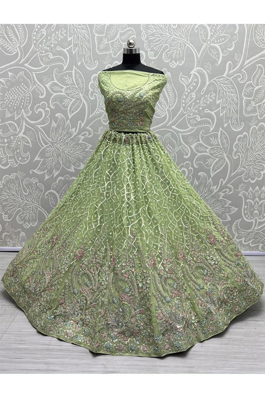 Engaging Green Color Net Fabric Heavy Look Embroidered Work Bridal Lehenga Choli