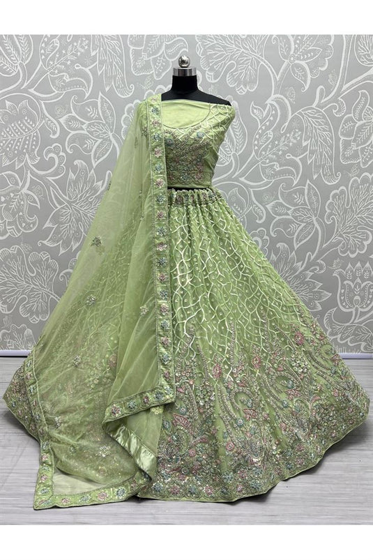 Engaging Green Color Net Fabric Heavy Look Embroidered Work Bridal Lehenga Choli